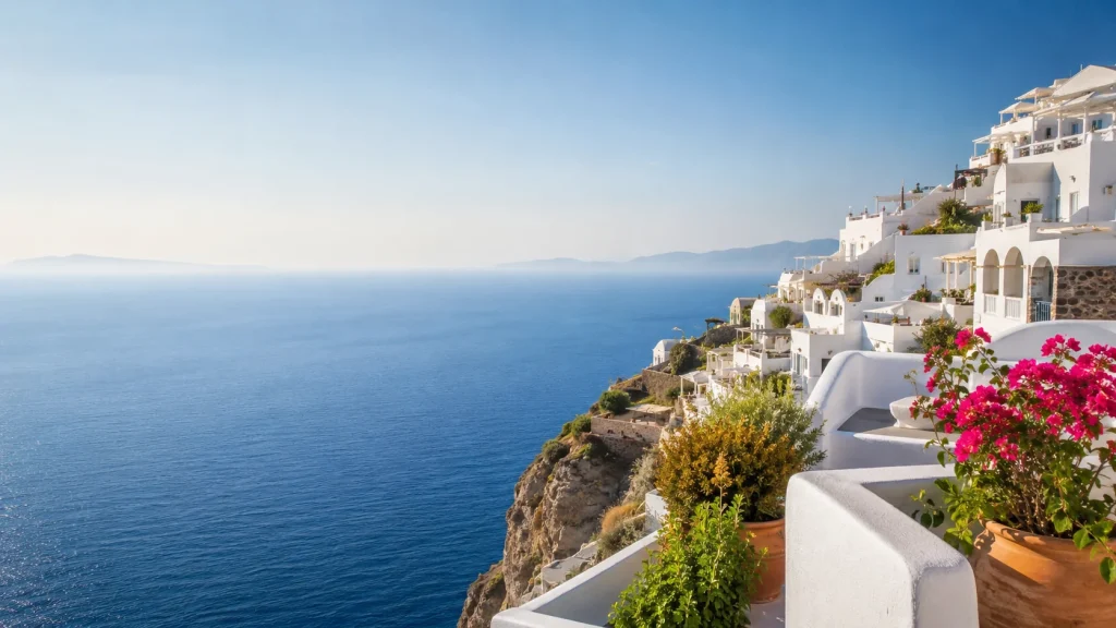 White cliffside Mediterranean village above a calm blue sea